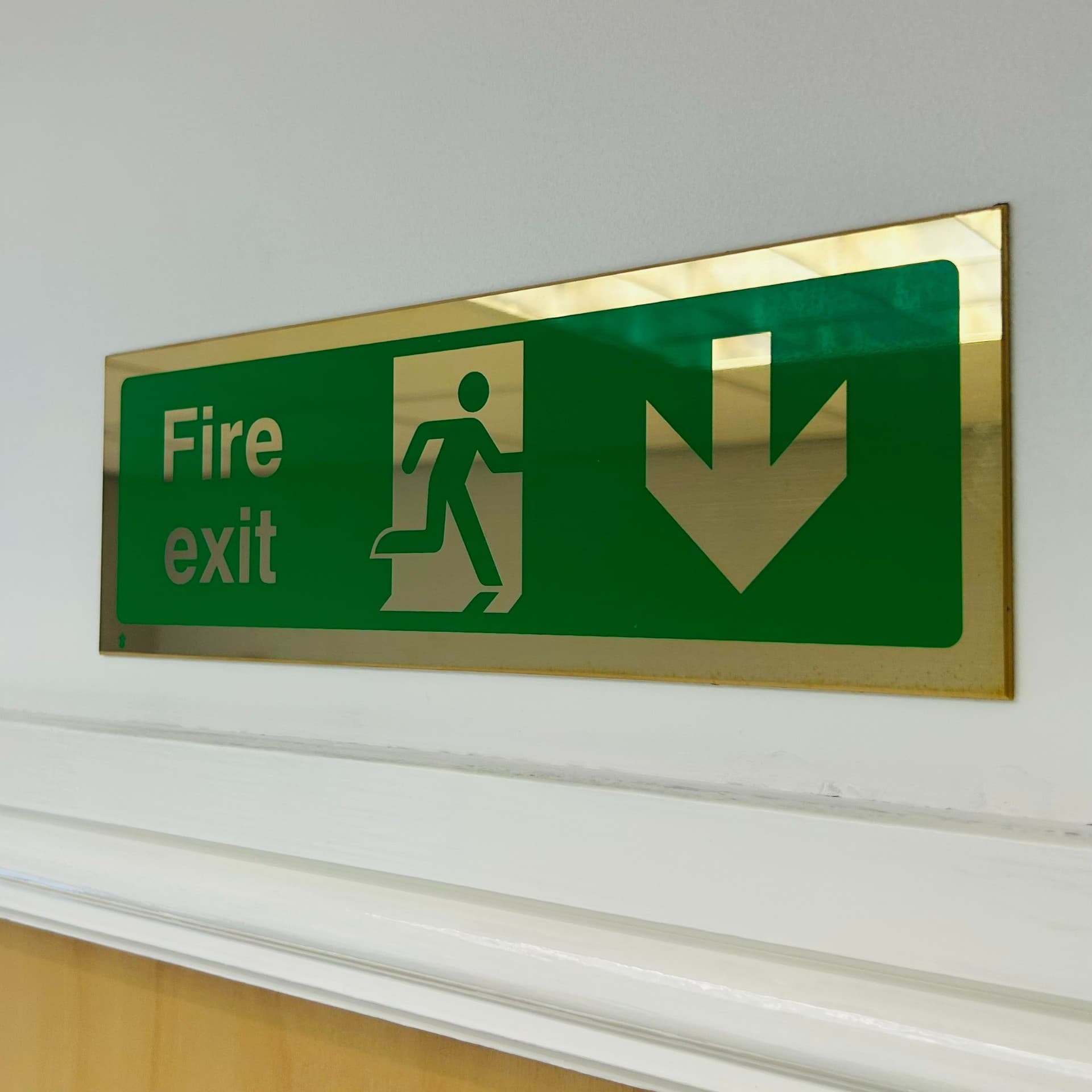 Polished Brass Fire Exit Arrow Down Sign with Running Man | 300mm x 100mm